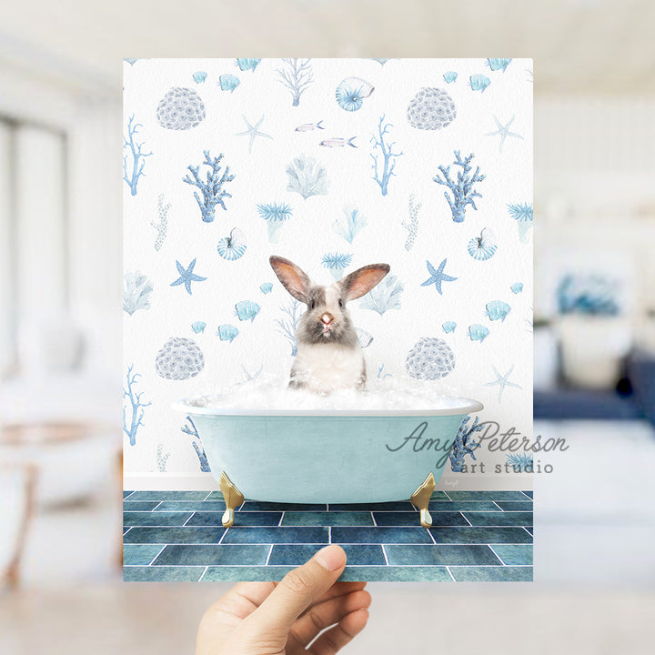 a person holding up a card with a picture of a rabbit in a bathtub