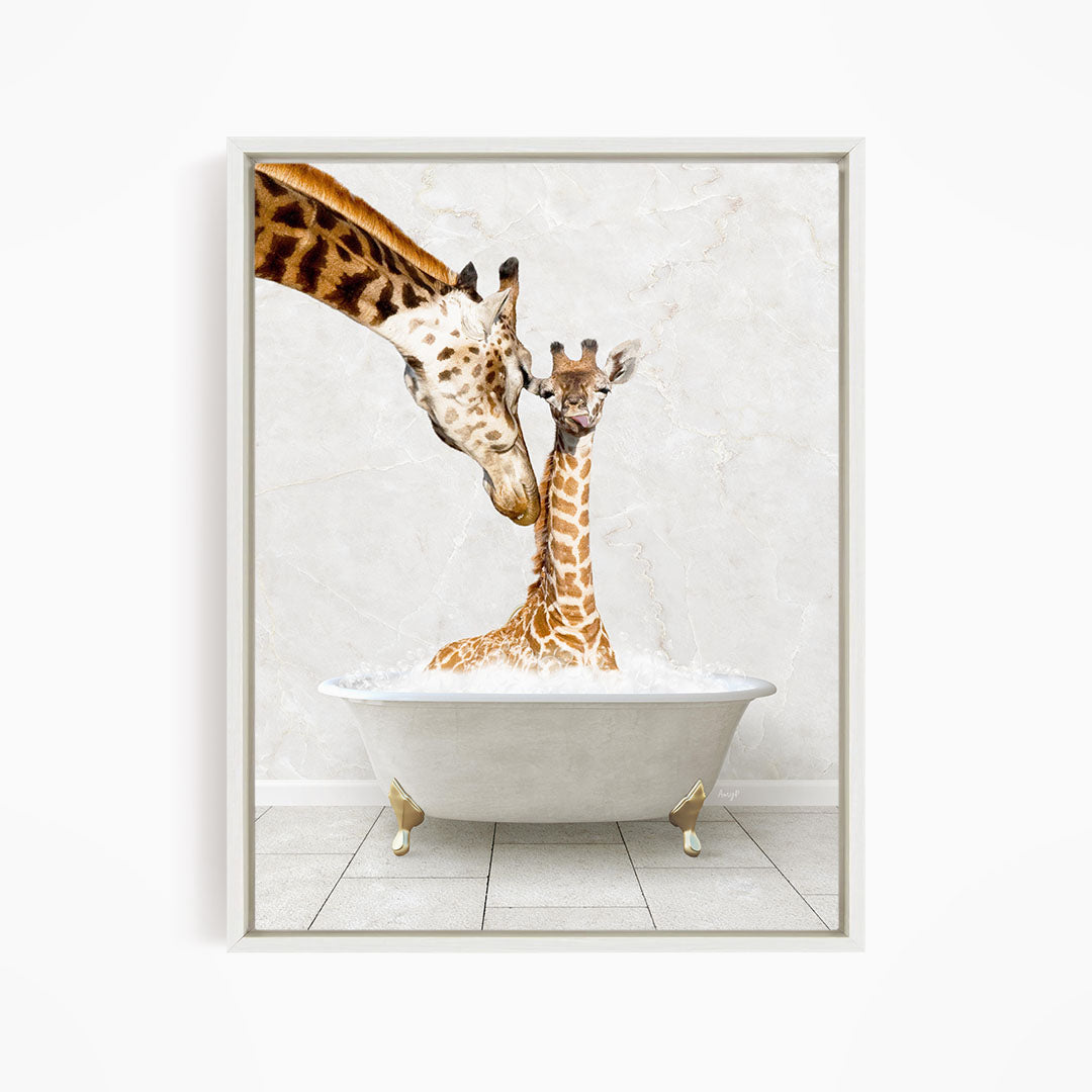 A mother giraffe and her baby giraffe are sitting together in a white bathtub, with the mother gently nuzzling her baby.