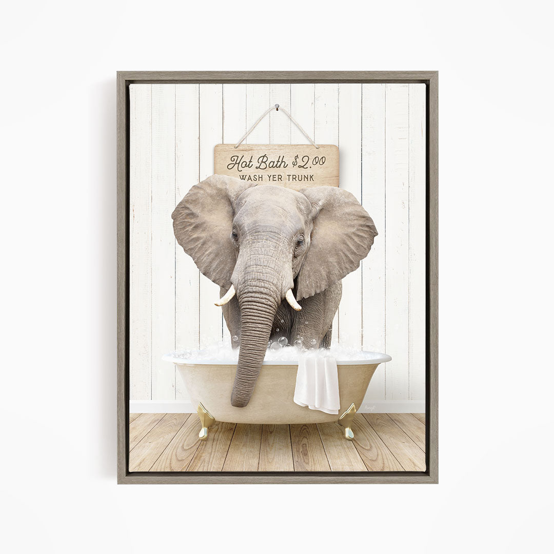 A gray elephant is sitting in a bathtub filled with water, with a sign above it that reads "Hot Bath $1.00 WASH YOUR TRunk".