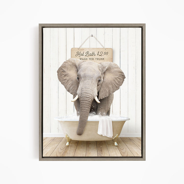A gray elephant is sitting in a bathtub filled with water, with a sign above it that reads "Hot Bath $1.00 WASH YOUR TRunk".