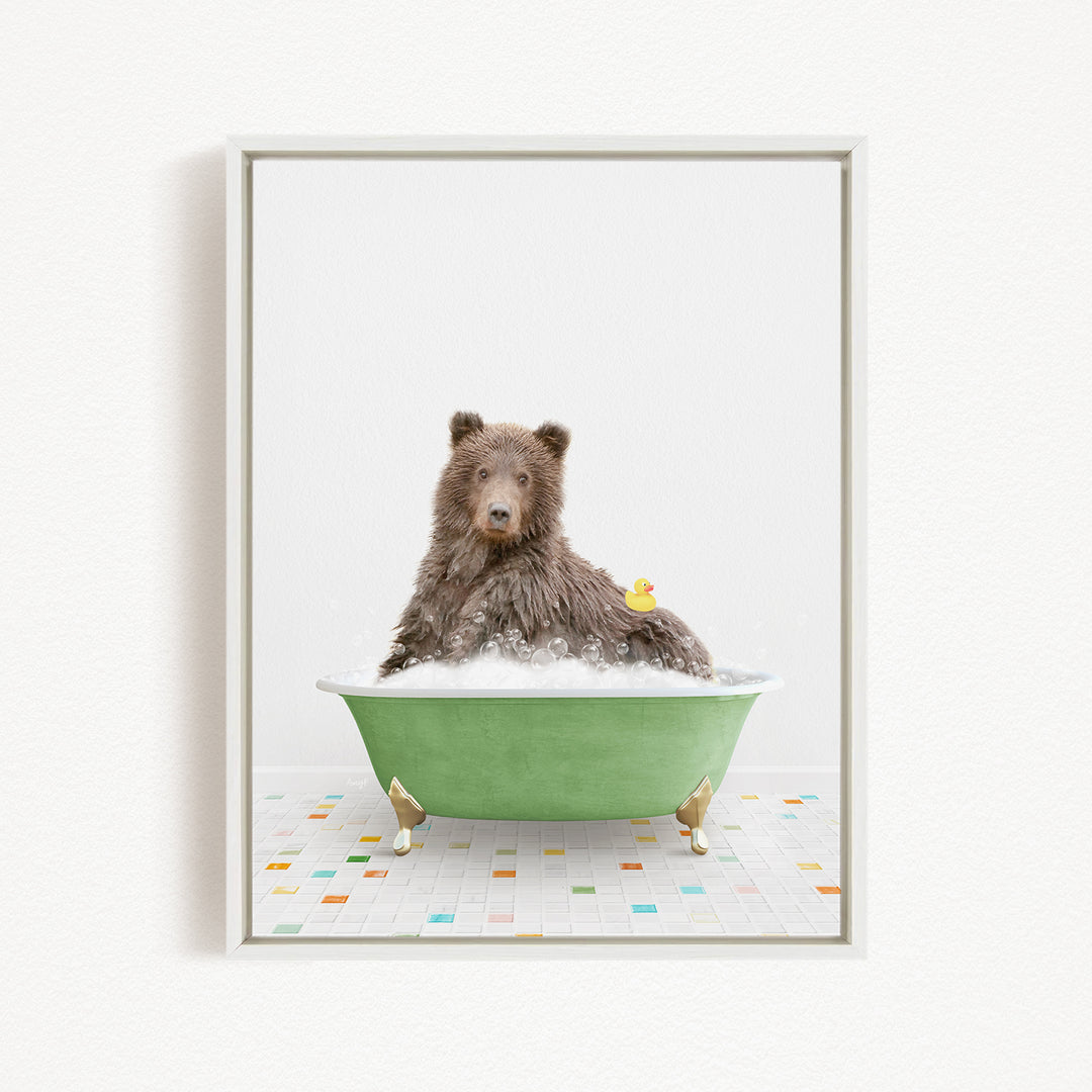 A brown bear sitting in a green bathtub filled with bubbles, with a rubber duck floating on the water.