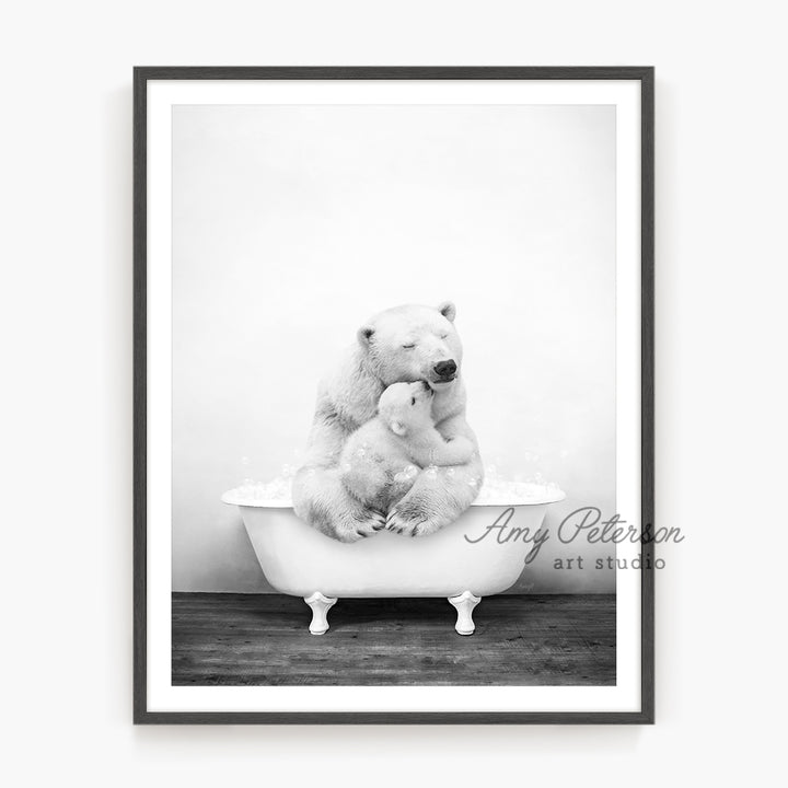 a black and white photo of two polar bears in a bathtub