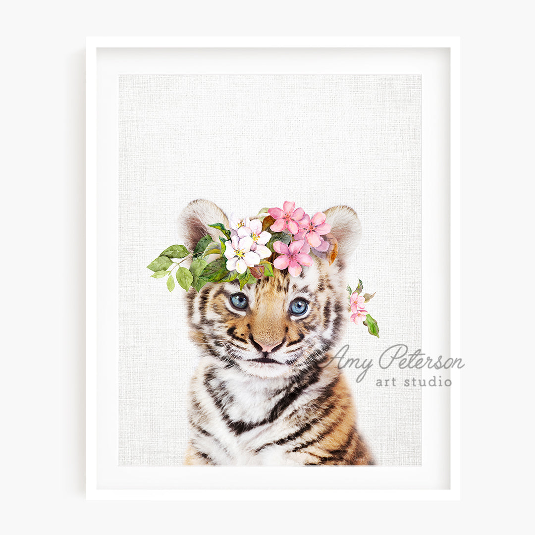 a picture of a tiger cub wearing a flower crown