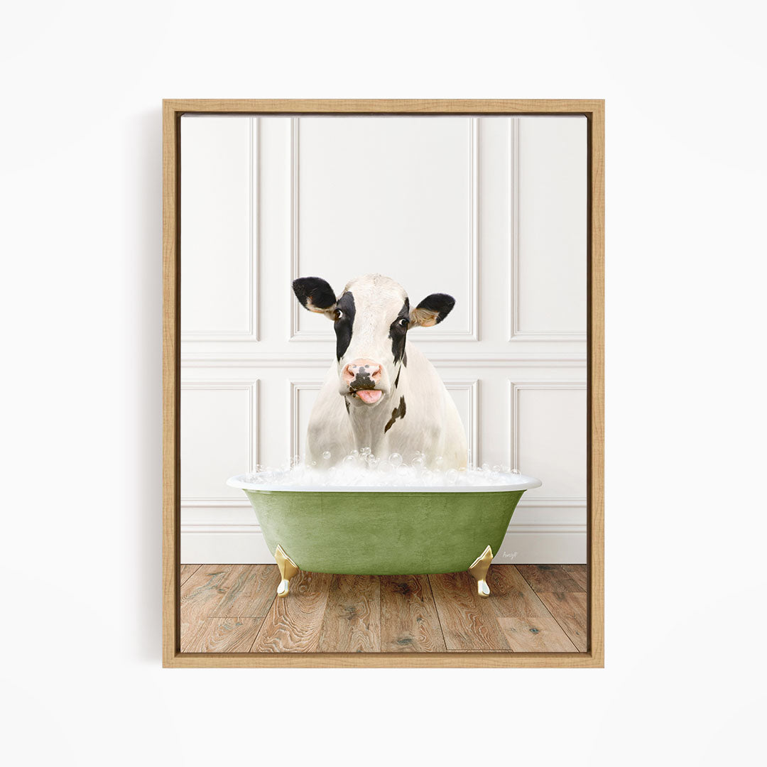 A black and white cow is sitting in a green bathtub filled with water, creating a whimsical and humorous scene.