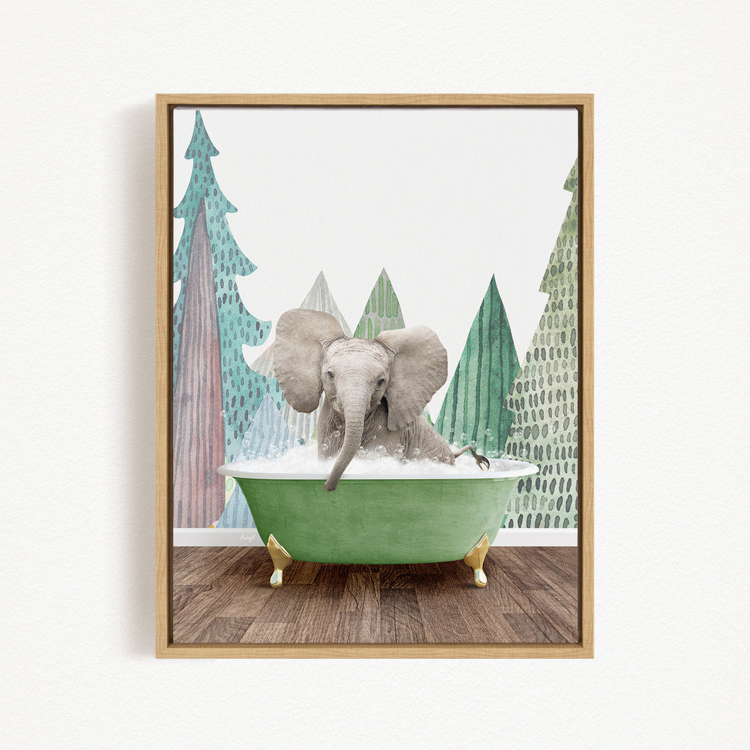 A gray elephant is sitting in a green bathtub, surrounded by trees with green and brown foliage.