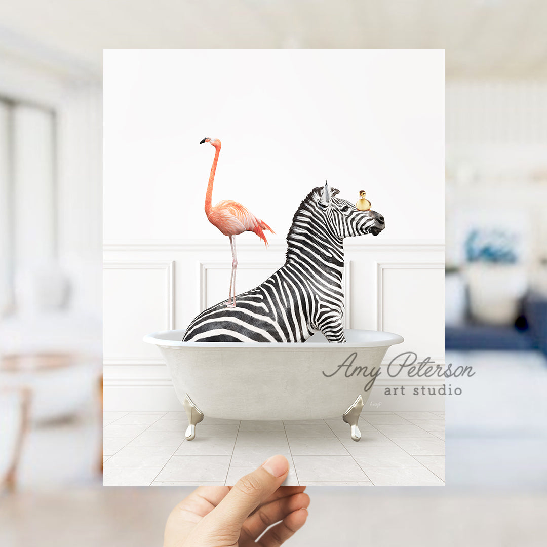 a hand holding a card with a zebra and a flamingo in a bathtub