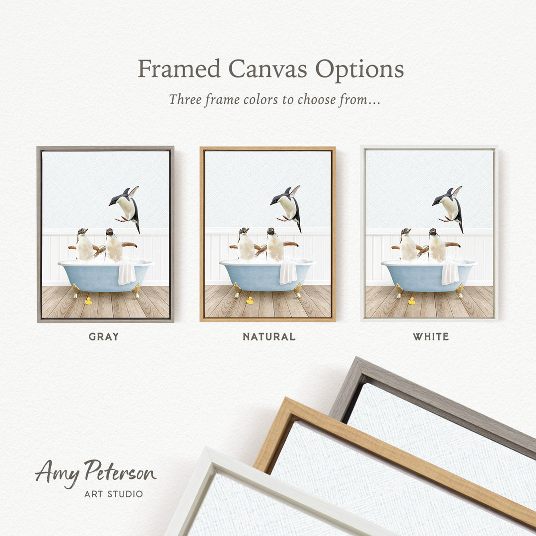 The image is a framed canvas option showcasing three different frame colors: gray, natural, and white. The canvas features a scene of three penguins in a bathtub, with one penguin jumping out of the tub.