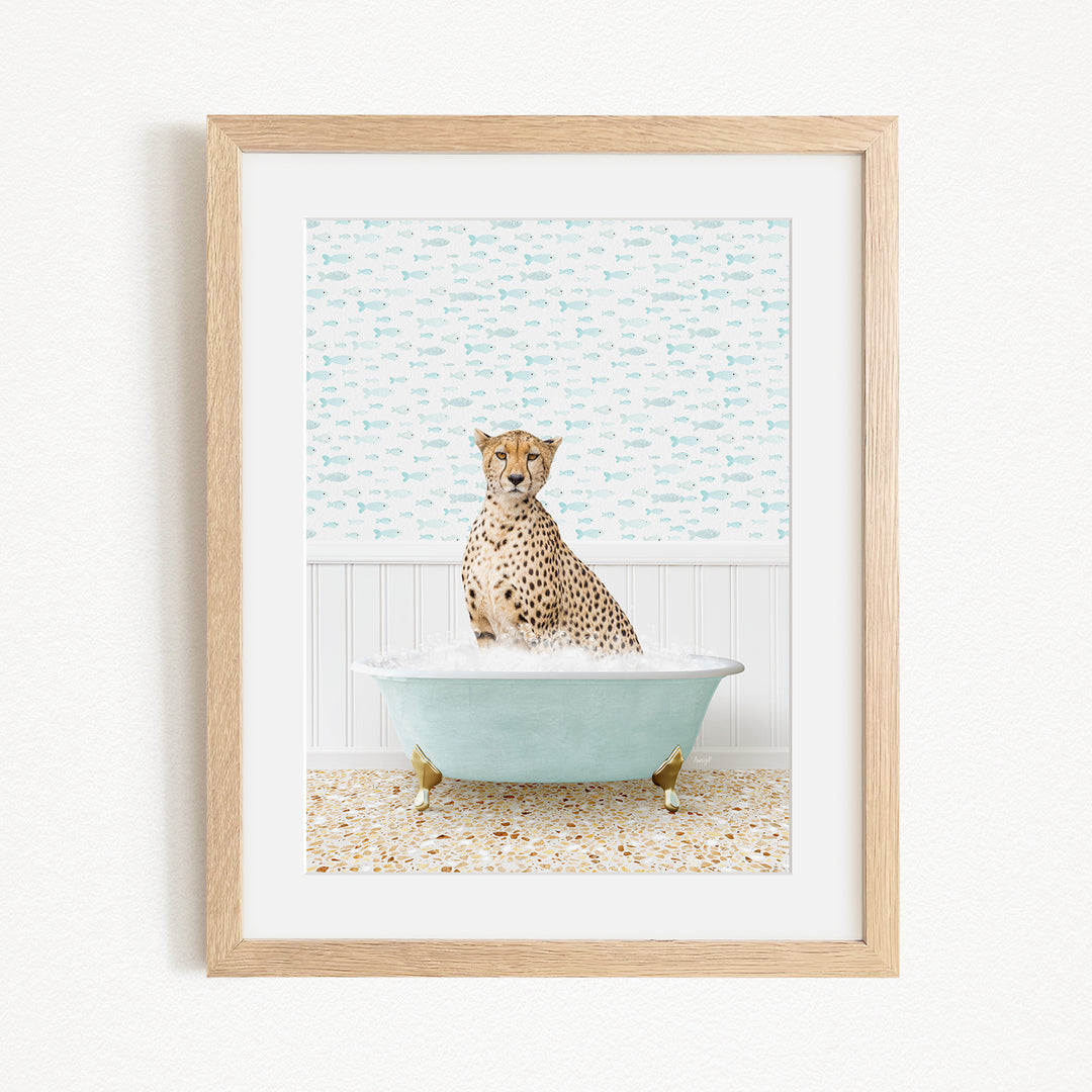 A cheetah sitting in a blue bathtub filled with water, surrounded by a patterned wall.