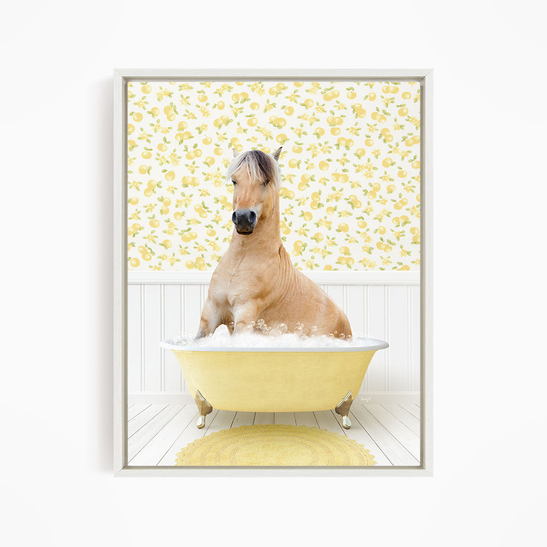 A light brown horse is sitting in a yellow bathtub filled with water, surrounded by a yellow floral wallpaper.