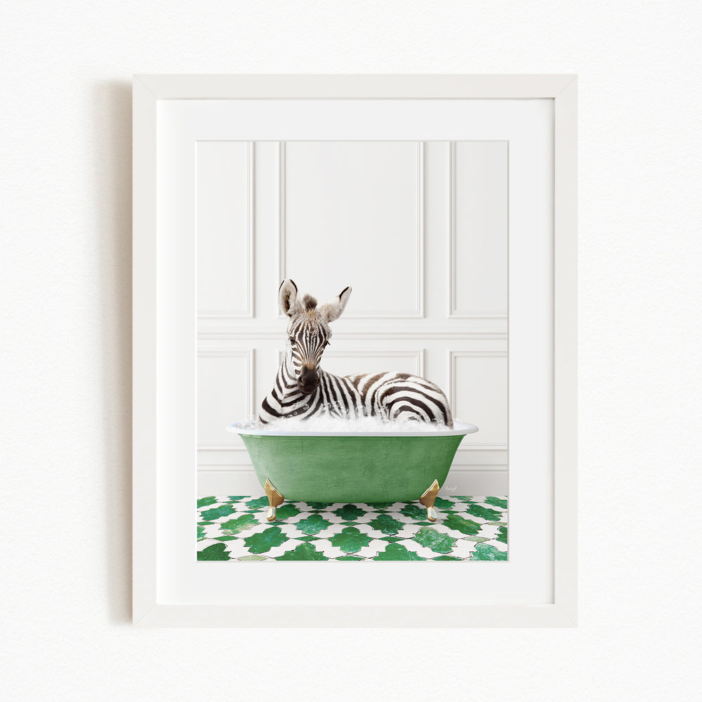 A zebra is sitting in a green bathtub, surrounded by a patterned green and white rug.