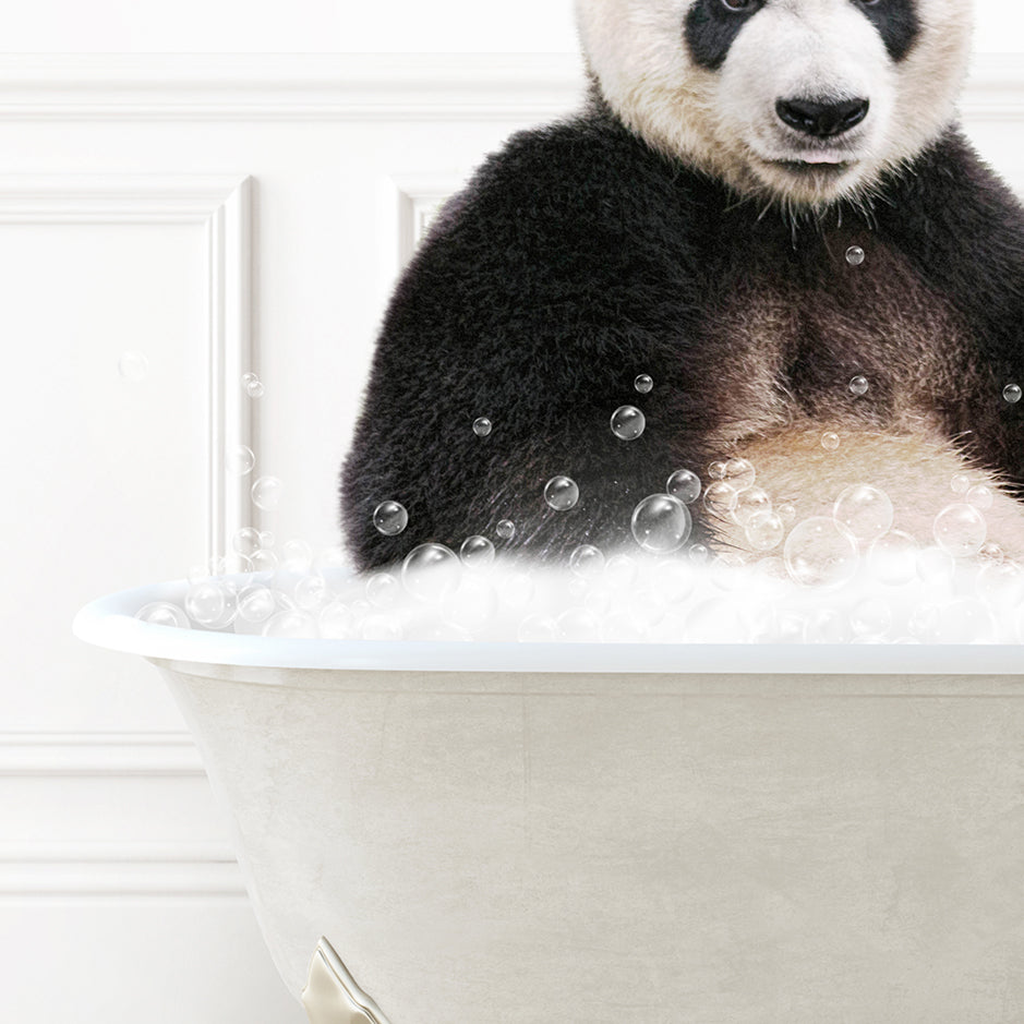 a panda bear sitting in a bathtub full of bubbles