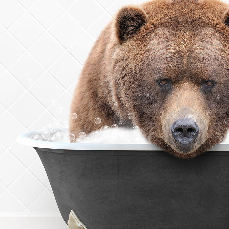 a brown bear taking a bath in a bathtub