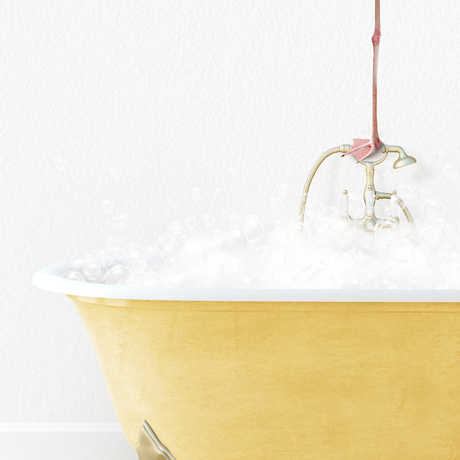 a bathtub filled with bubbles and a pink flower