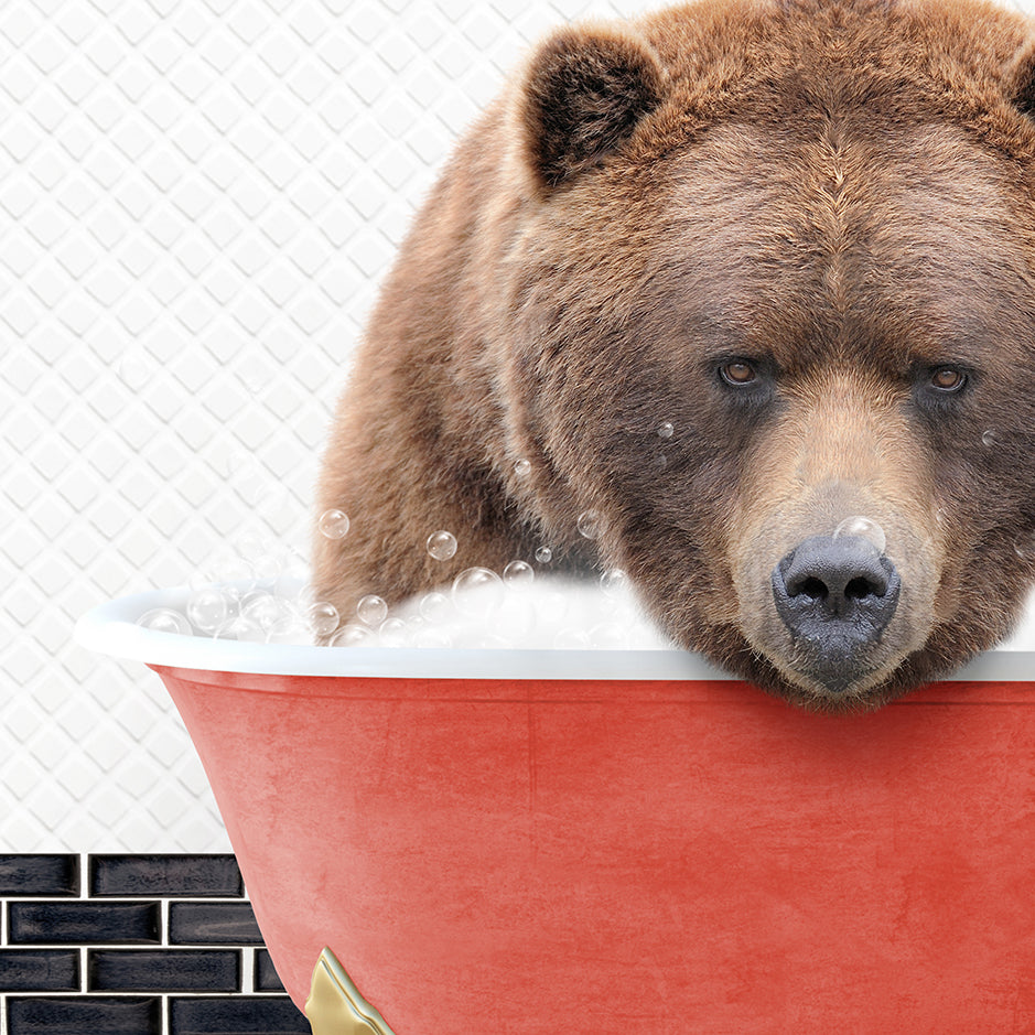 a brown bear is taking a bath in a red tub