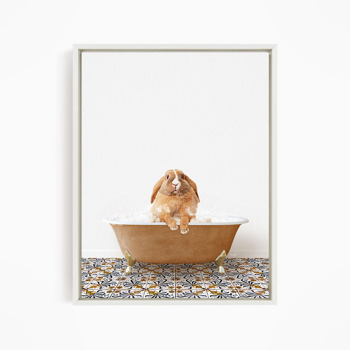 A brown rabbit sitting in a bathtub filled with water, surrounded by a patterned tile floor.