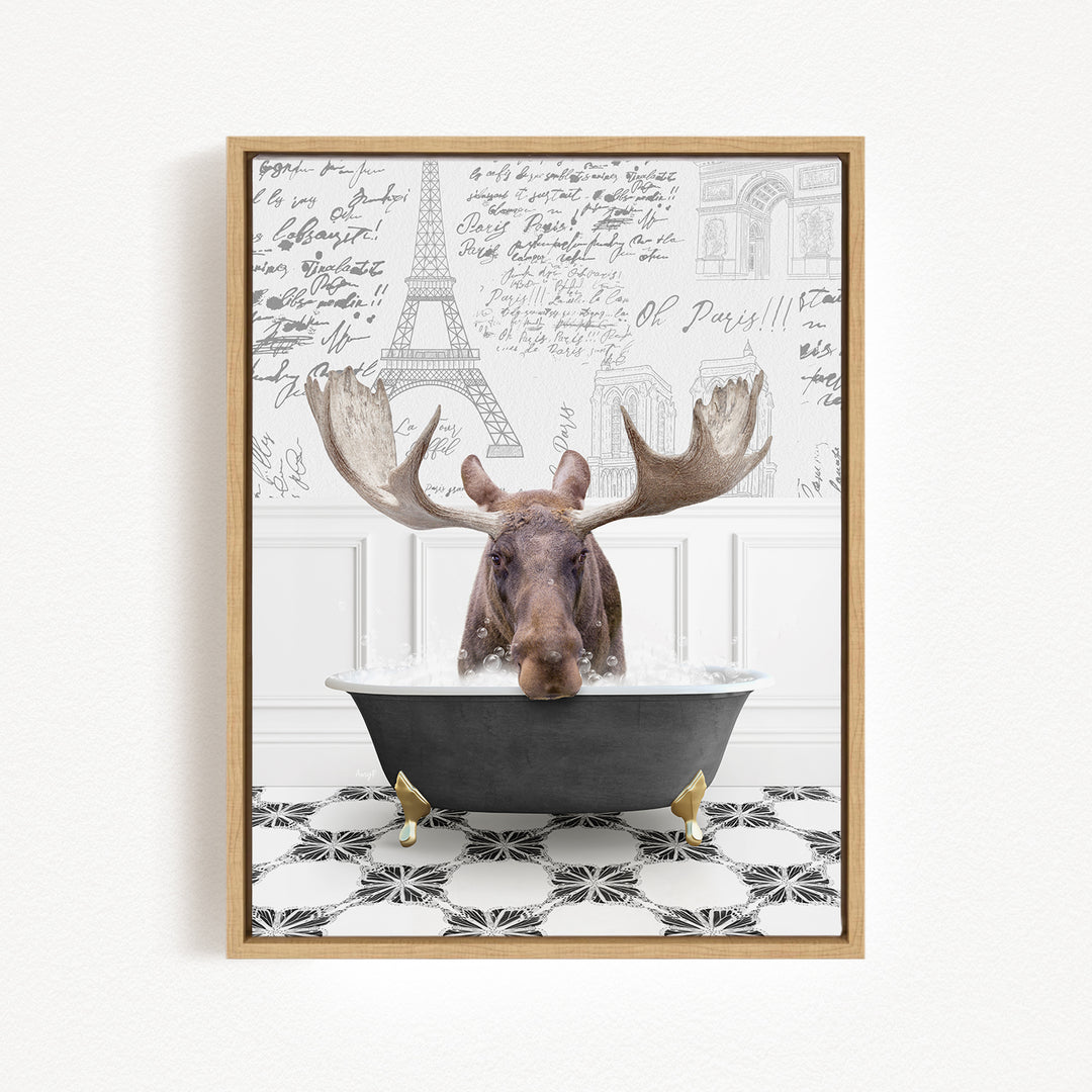 A moose with large antlers is sitting in a bathtub filled with water, surrounded by a black and white tiled floor and a wall with various inscriptions and drawings.