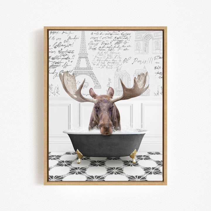 A moose with large antlers is sitting in a bathtub filled with water, surrounded by a black and white tiled floor and a wall with various inscriptions and drawings.