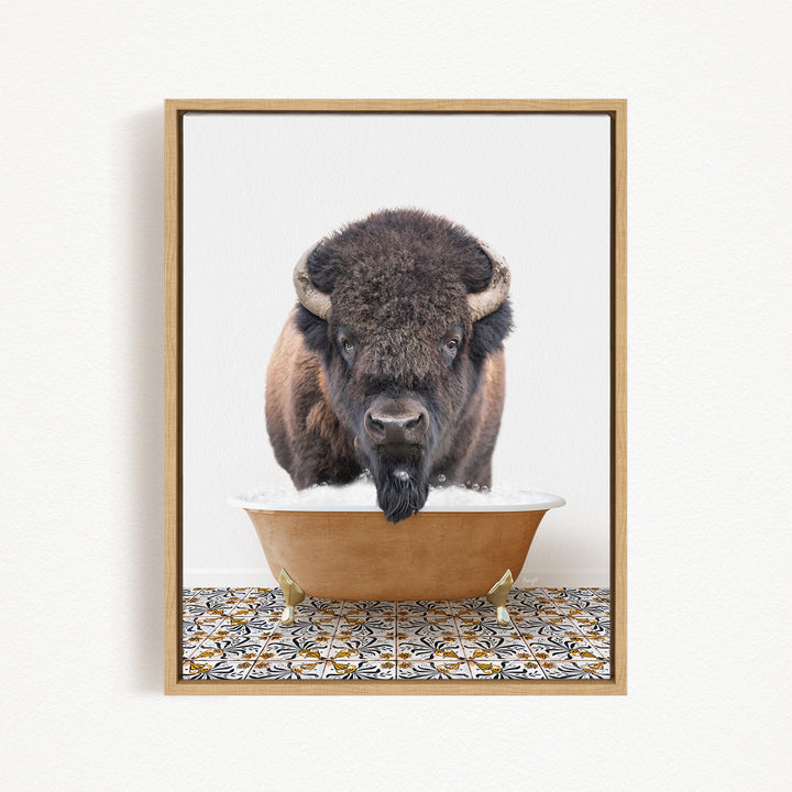 A close-up of a bison with large horns standing in a bathtub filled with water.