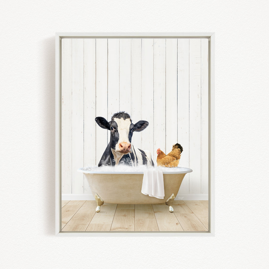 A black and white cow is sitting in a bathtub filled with water, with a chicken nearby, in a white wooden wall.