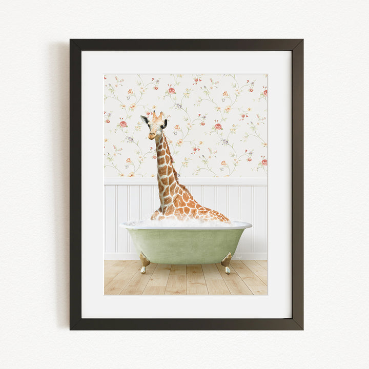 A giraffe sitting in a green bathtub filled with bubbles, surrounded by a floral wallpaper.