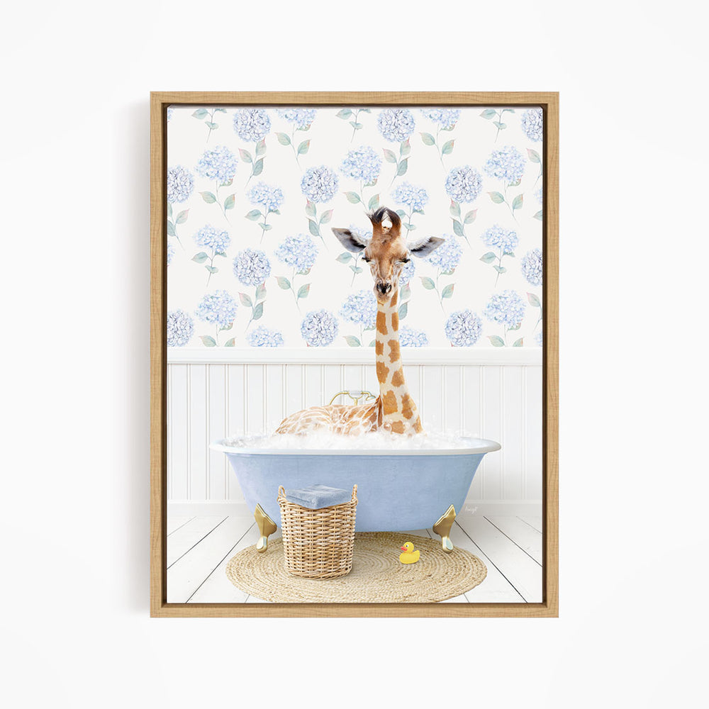 A giraffe is sitting in a blue bathtub filled with water, surrounded by a wicker basket and rubber ducks.