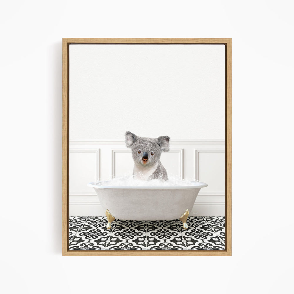 A koala bear sitting in a bathtub filled with water, surrounded by a black and white patterned floor.