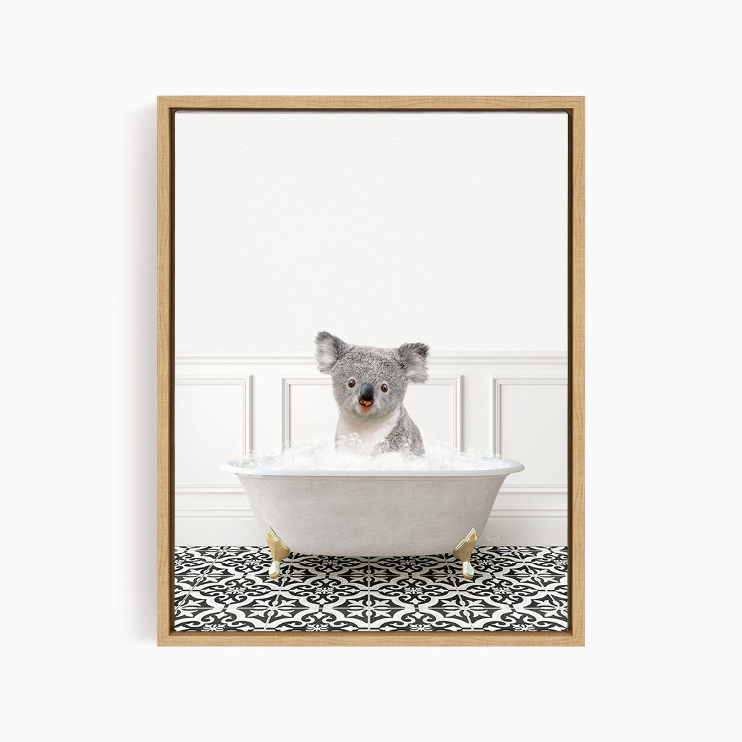 A koala bear sitting in a bathtub filled with water, surrounded by a black and white patterned floor.
