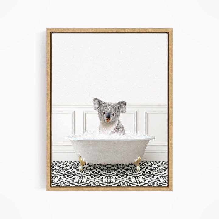 A koala bear sitting in a bathtub filled with water, surrounded by a black and white patterned floor.