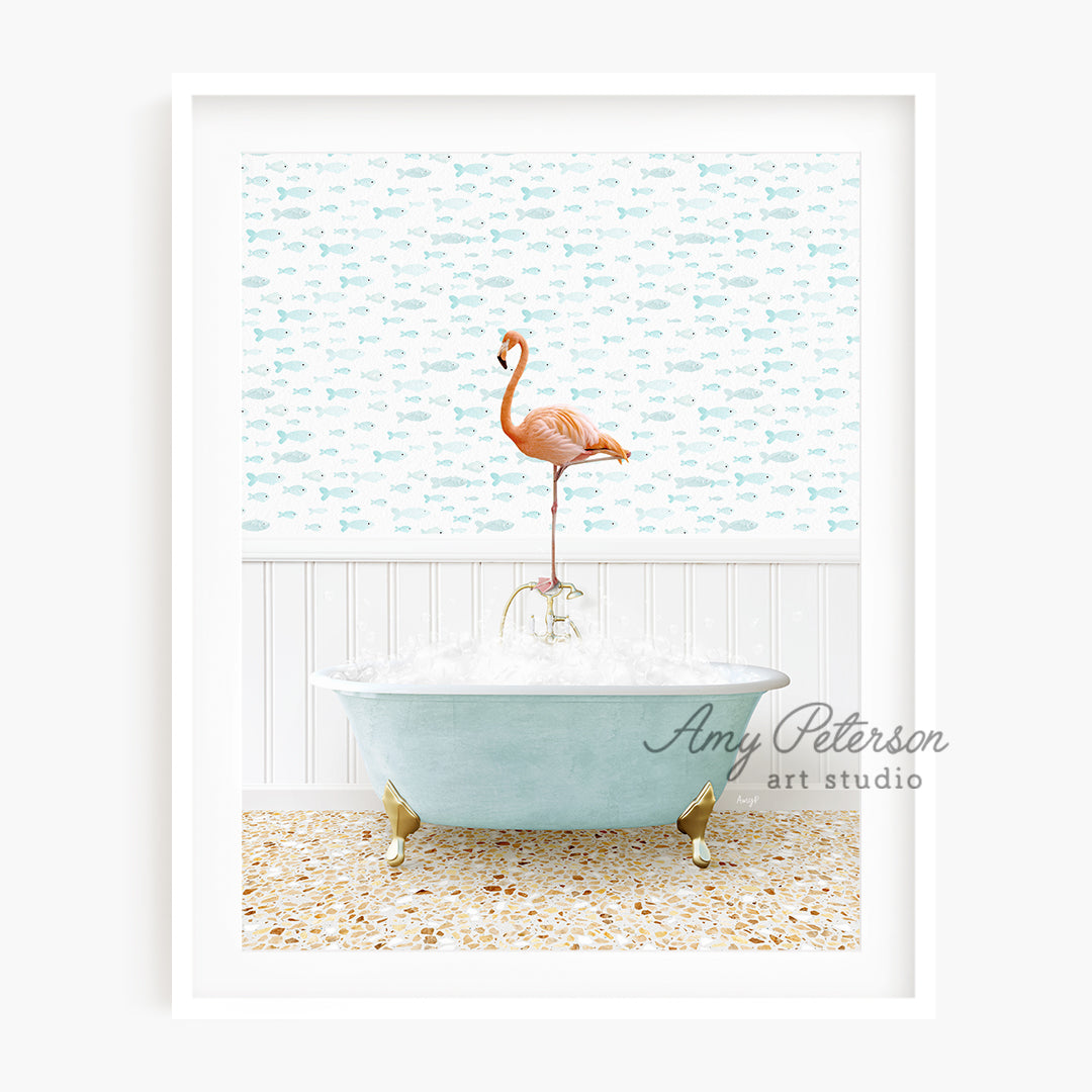 a pink flamingo standing on top of a bath tub