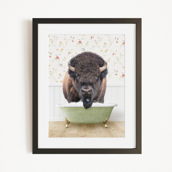 A buffalo with a long beard is standing in a green bathtub, with a floral wallpaper in the background.