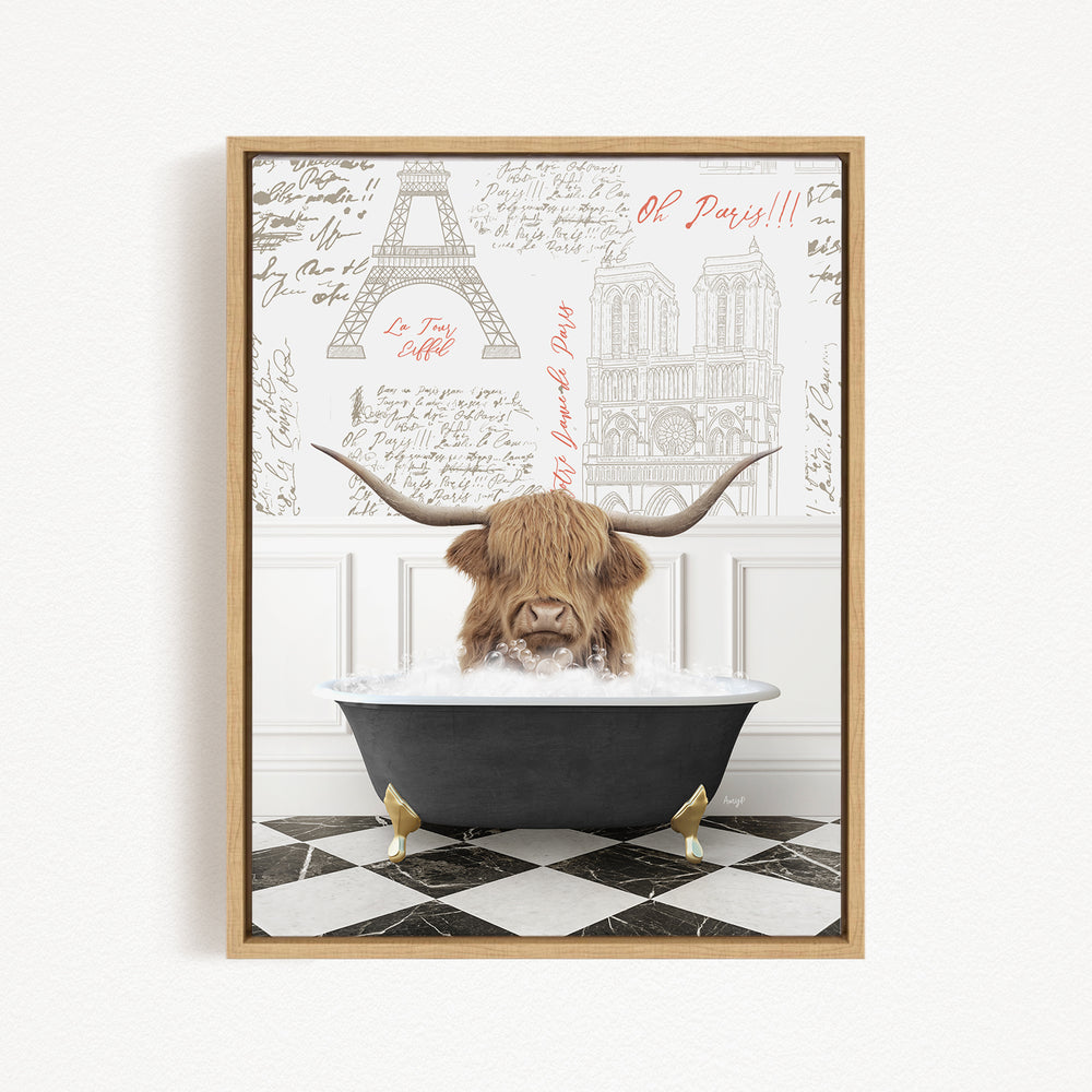 A brown cow with long horns is sitting in a black bathtub filled with water, with a framed image of the Eiffel Tower in the background.