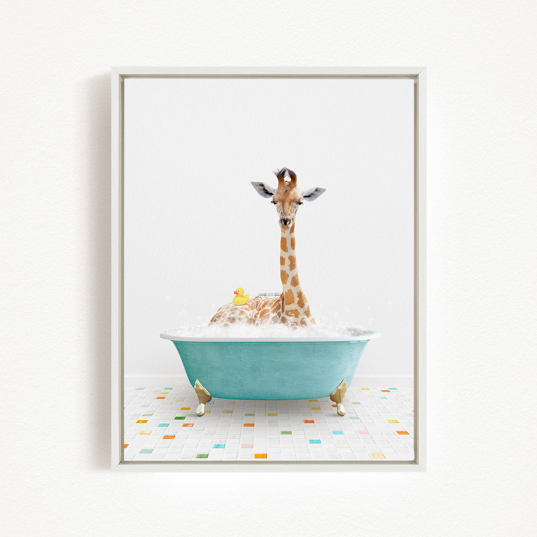 A giraffe sitting in a blue bathtub filled with bubbles, surrounded by a yellow rubber duck.