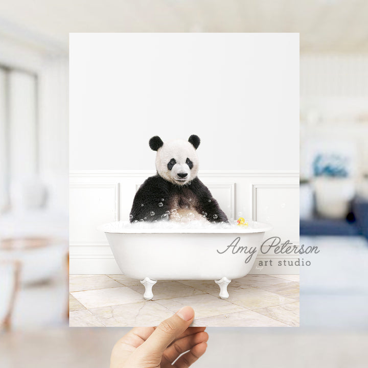 a person holding up a card with a panda bear in a bathtub