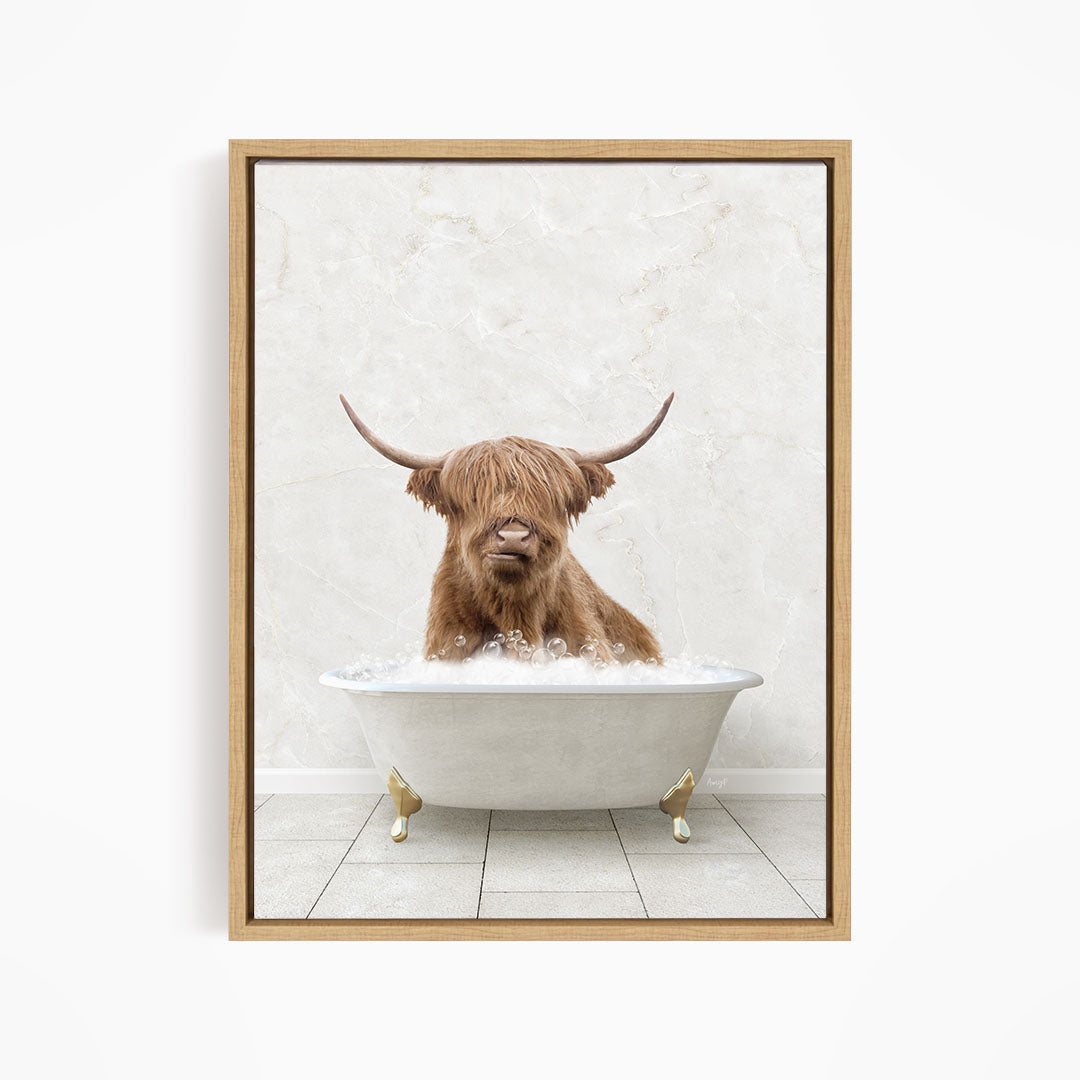 A brown cow with long horns is sitting in a white bathtub filled with water, creating a whimsical and humorous scene.