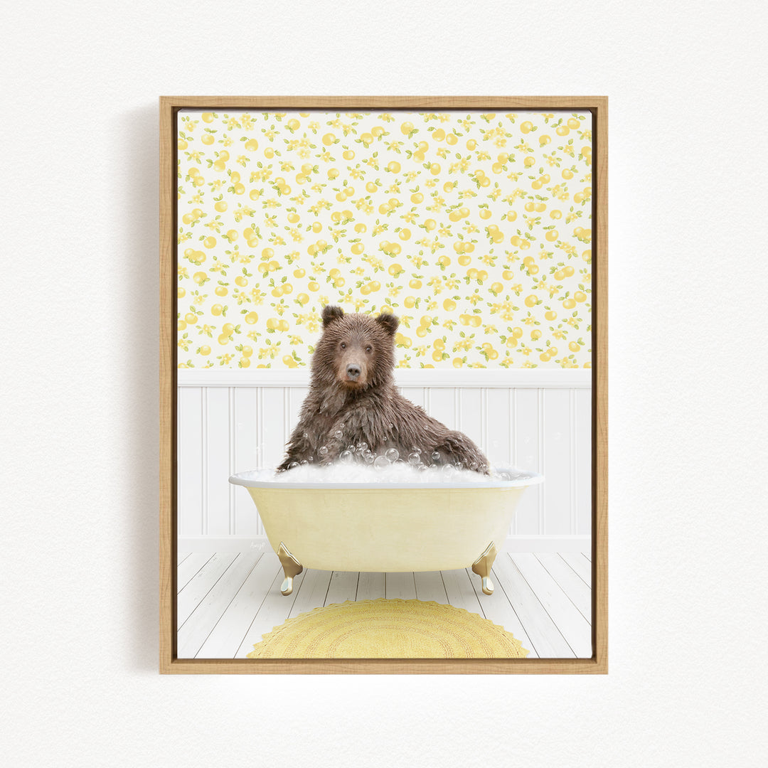 A brown bear sitting in a bathtub filled with bubbles, surrounded by a yellow floral pattern on the walls.