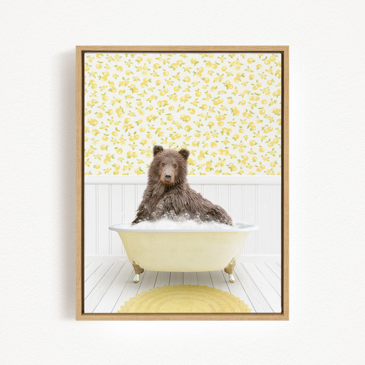 A brown bear sitting in a bathtub filled with bubbles, surrounded by a yellow floral pattern on the walls.