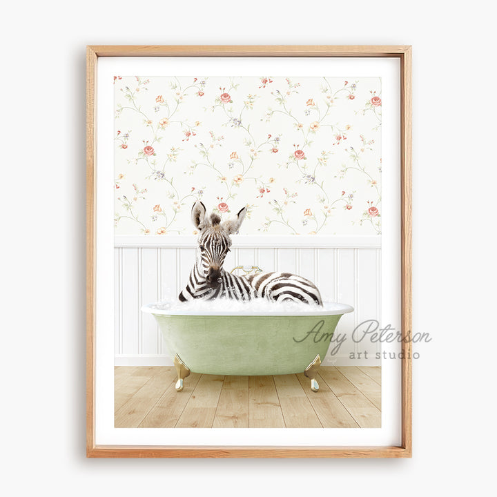 a zebra laying in a bathtub with a wallpaper behind it