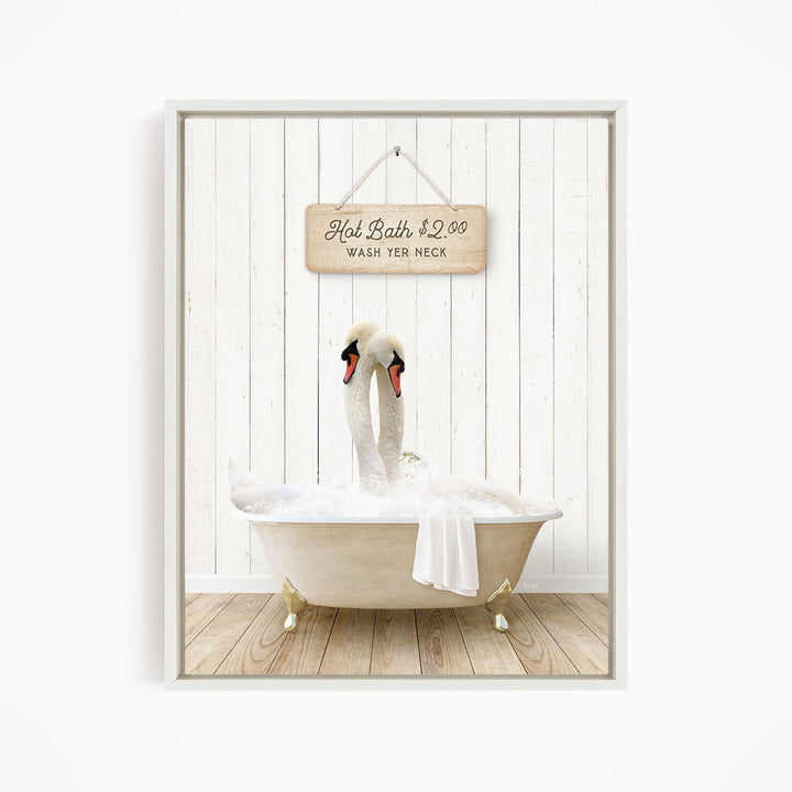 A framed image of two swans sitting in a bathtub, with a sign above them that reads "Hot Bath $2.00 WASH YER necks".