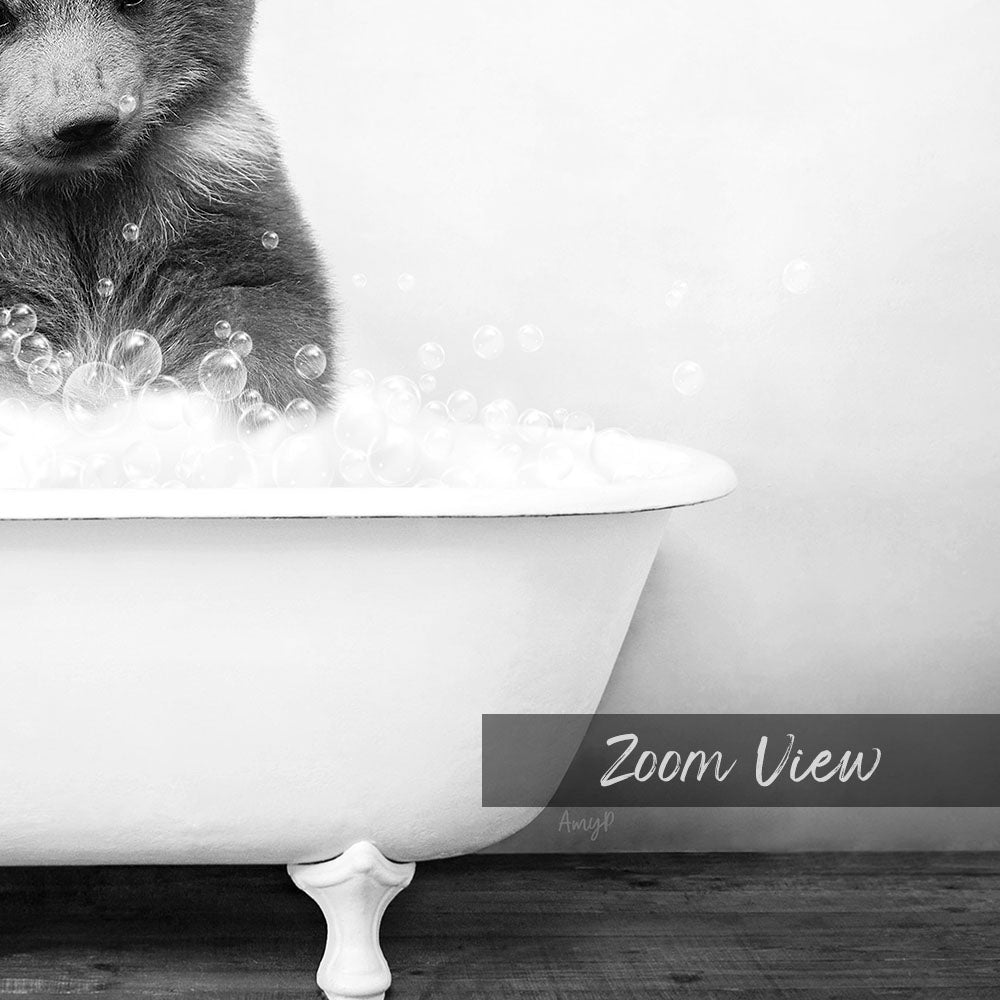 A black and white image of a bear sitting in a bathtub filled with bubbles, with the text "Zoom View" overlaid on the image.