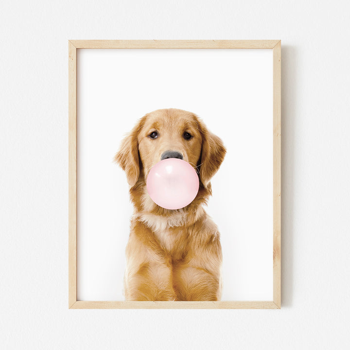 a dog with a bubble gum in its mouth