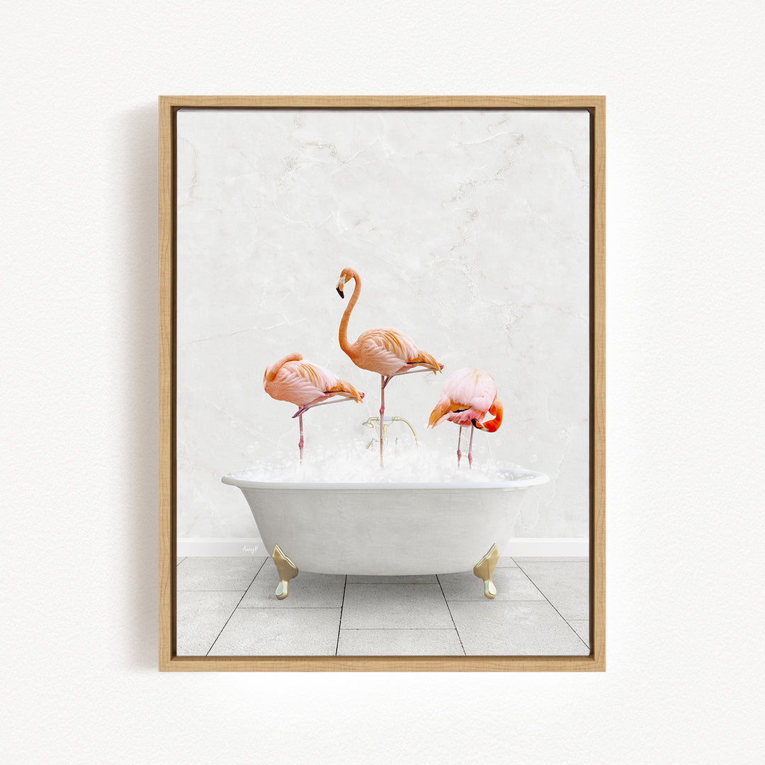 A framed image depicting three flamingos standing in a white bathtub filled with water.