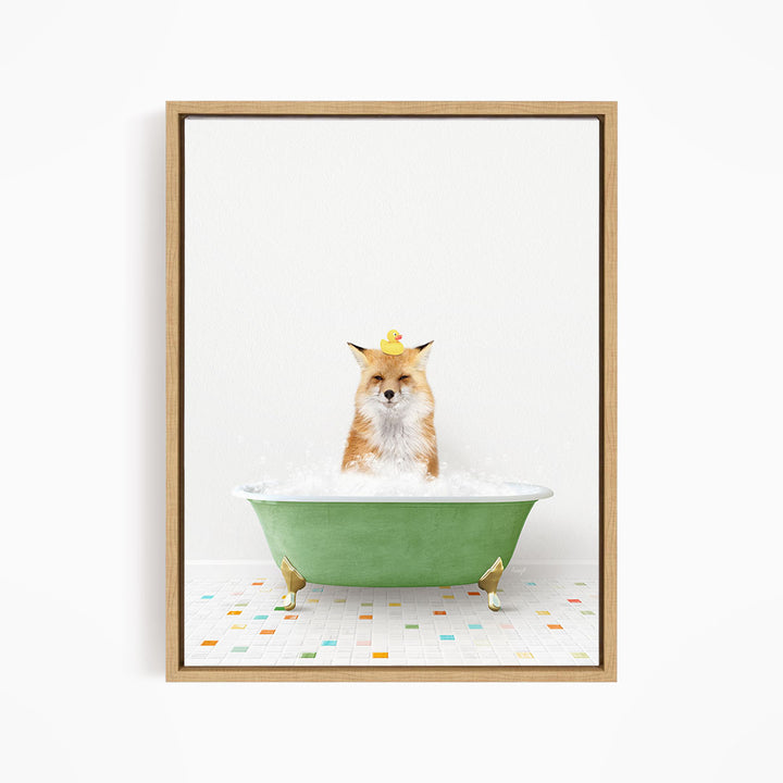 A fox is sitting in a green bathtub filled with bubbles, with a rubber duck perched on its head.