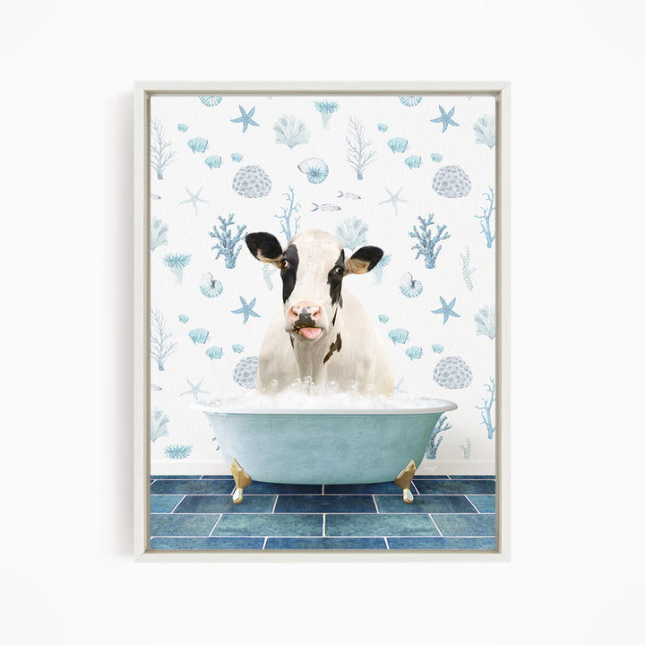A cow is sitting in a bathtub filled with bubbles, surrounded by a blue and white ocean-themed wallpaper.
