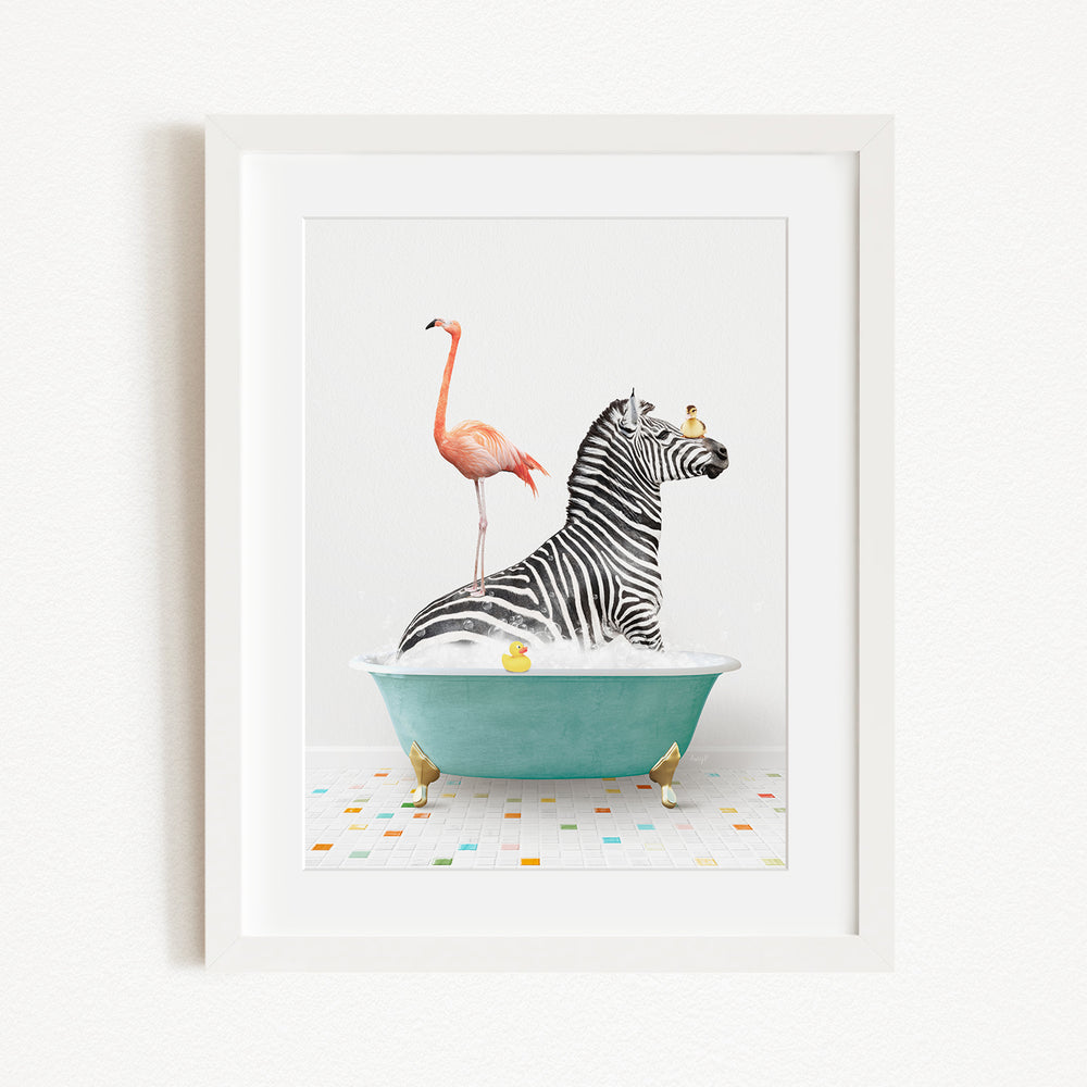 A framed image depicting a zebra standing in a bathtub filled with bubbles, with a flamingo standing on the zebra's back and a bird perched on the zebra's head.