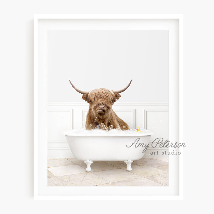 a brown dog sitting in a bathtub with long horns