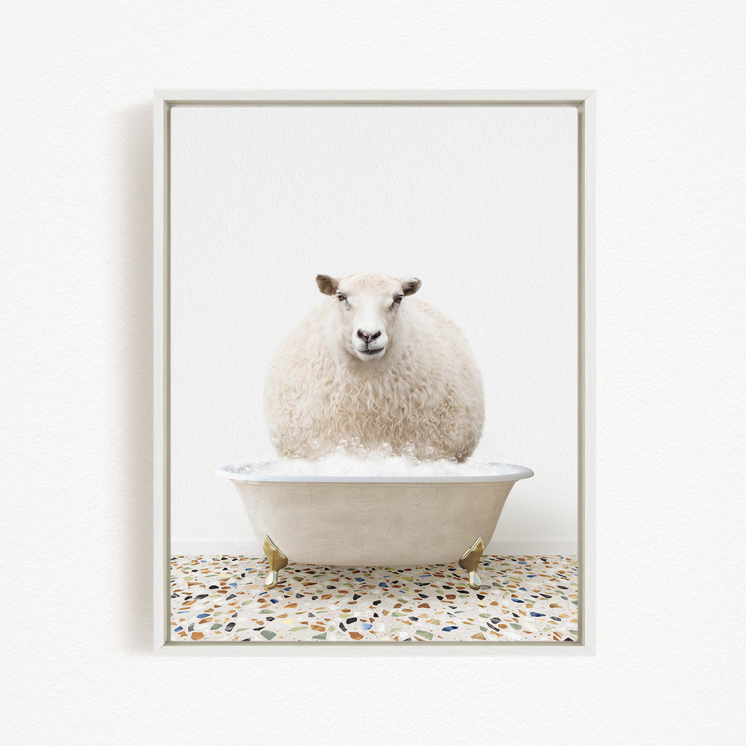 A fluffy white sheep sits in a white bathtub filled with bubbles, creating a whimsical and playful scene.