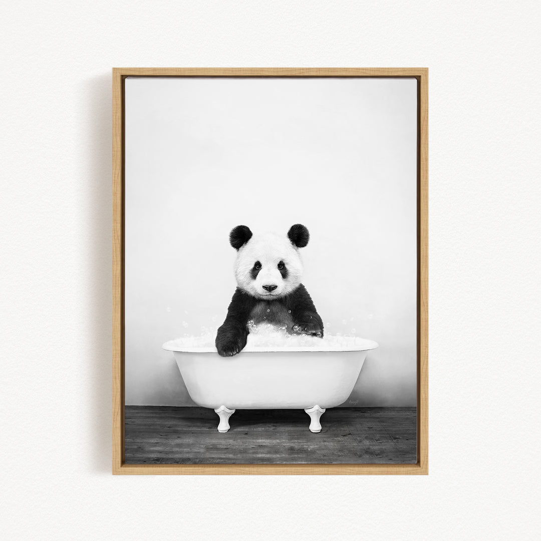 A panda bear sitting in a white bathtub filled with bubbles, creating a whimsical and playful scene.