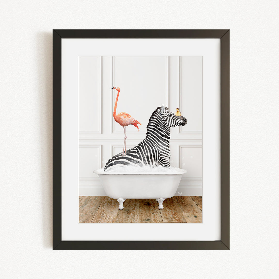 A framed image depicting a zebra sitting in a bathtub, with a flamingo standing on its back.