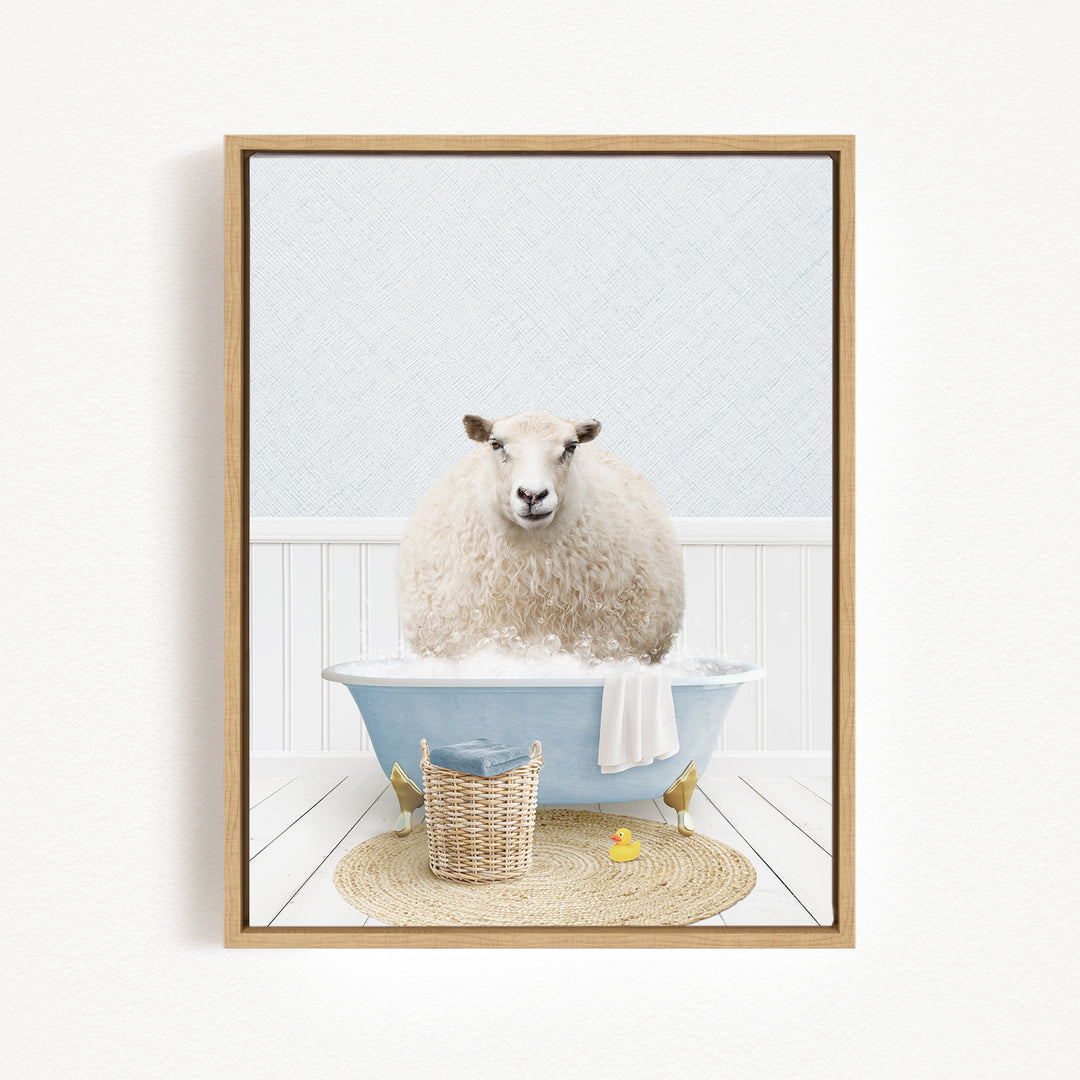 A fluffy white sheep sits in a blue bathtub filled with bubbles, surrounded by a basket of bath toys and a yellow rubber duck.