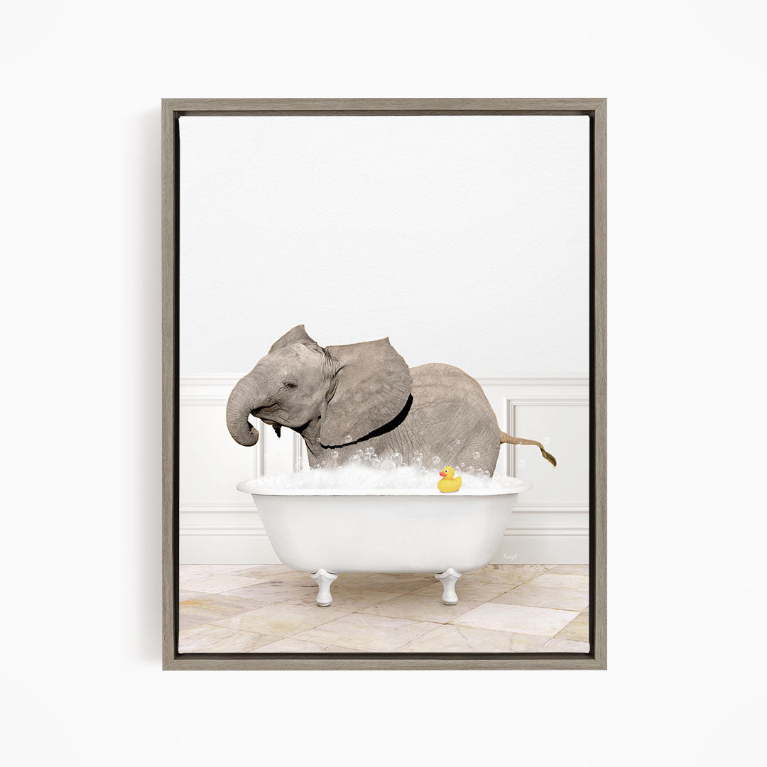 A gray elephant is standing in a white bathtub filled with water, with a yellow rubber duck floating on the water.